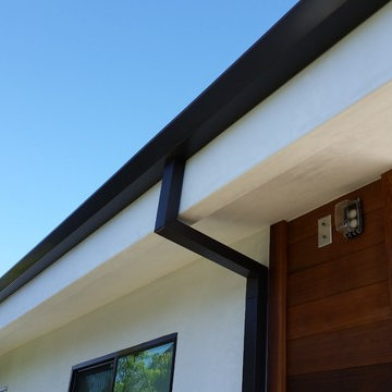 Costa Mesa, New Modern Home. Angle Face 5 inch Gutters, Smooth Downspouts.