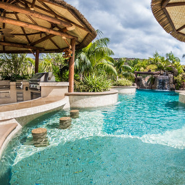 Tropical Beach Entry Pool & Spa with a Rock Slide & Grotto