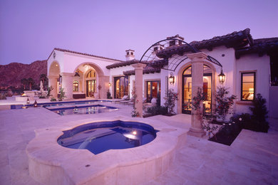 Mid-sized transitional white one-story stucco house exterior photo in San Diego with a hip roof and a tile roof
