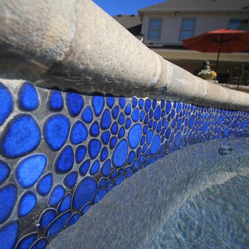 Custom Freeform style salt water in ground pool with Pool House and Raised Spa
