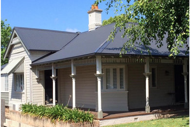 This is an example of a mid-sized one-storey exterior in Sydney with a hip roof.