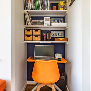 Inspiration for a small transitional study room in Richmond with white walls, bamboo floors, a freestanding desk and brown floor.