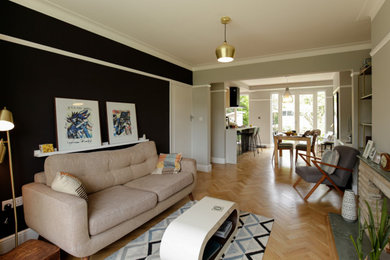 This is an example of a medium sized scandi living room in London.