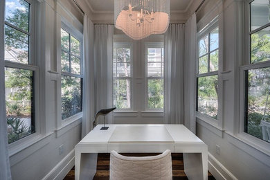 Study room - mid-sized modern freestanding desk dark wood floor and brown floor study room idea in Miami with white walls