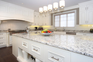 Kitchen - contemporary kitchen idea in Calgary with recessed-panel cabinets and white cabinets