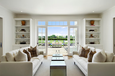 Family room - traditional enclosed light wood floor and beige floor family room idea in New York with white walls, no fireplace and no tv