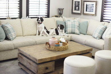 Example of a transitional enclosed living room design in San Diego with gray walls