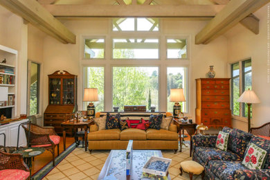 Living room - large enclosed medium tone wood floor, multicolored floor and exposed beam living room idea in San Francisco with beige walls and no tv