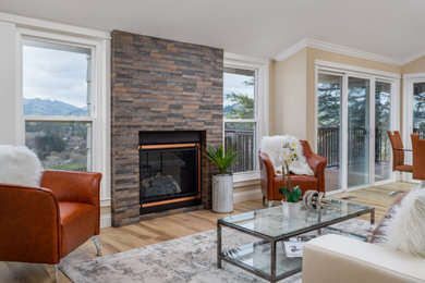 Living room - large transitional vinyl floor and beige floor living room idea in San Francisco with beige walls, a standard fireplace and a stacked stone fireplace