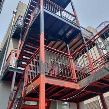 Metal porch refinishing. Rust removal, prming and painting.
