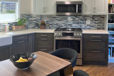 Example of a large beach style l-shaped open concept kitchen design in San Luis Obispo with gray cabinets