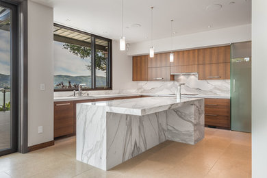 Design ideas for a modern u-shaped open plan kitchen in San Francisco with an undermount sink, flat-panel cabinets, medium wood cabinets, marble benchtops, multi-coloured splashback, stone slab splashback, panelled appliances and with island.