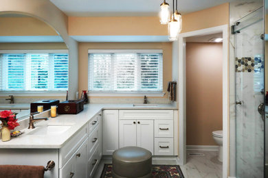 Large elegant master double-sink bathroom photo in Baltimore with white cabinets and a built-in vanity