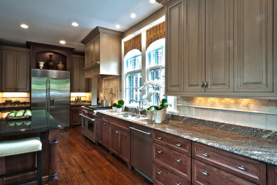 Large elegant l-shaped medium tone wood floor eat-in kitchen photo in Indianapolis with a double-bowl sink, raised-panel cabinets, medium tone wood cabinets, granite countertops, stainless steel appliances and an island