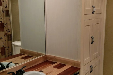 Example of a large mountain style 3/4 bathroom design in Austin with shaker cabinets, white cabinets and wood countertops