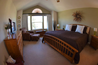 Mid-sized transitional master bedroom in Denver with green walls, carpet and beige floor.
