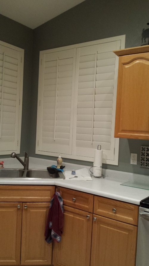 Kitchen Cabinets Next To White Shutters