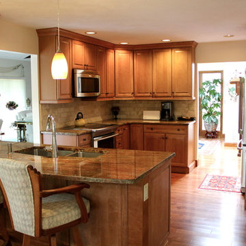 View of whole kitchen featuring peninsula, l-shaped corner and straight wall