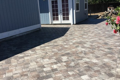 Design ideas for a large rustic full sun backyard concrete paver landscaping in San Francisco for summer.