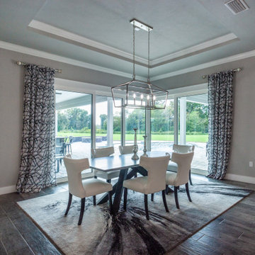Dining Area with Corner Slider and Custom Chandelier – Newberry, FL