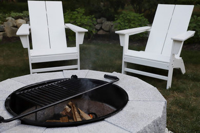 Patio - rustic backyard patio idea in Boston with a fire pit