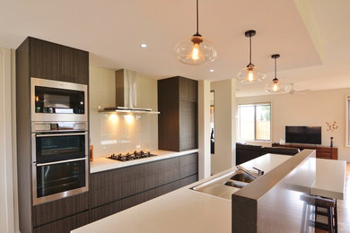 Modern galley kitchen in Melbourne with quartz benchtops and with island.