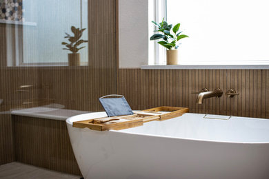 Example of a large minimalist master brown tile and wood-look tile double-sink and beige floor bathroom design in Dallas with green cabinets, quartzite countertops, a built-in vanity and beige walls