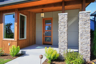 Example of a mid-sized trendy gray one-story mixed siding exterior home design in Seattle