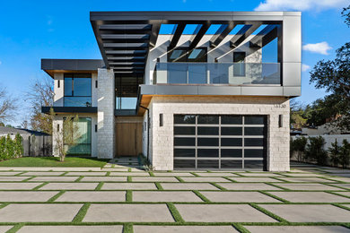 Huge trendy beige two-story exterior home photo in Los Angeles