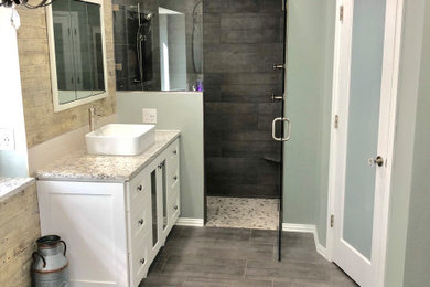 Design ideas for a large contemporary master bathroom in Dallas with shaker cabinets, white cabinets, a curbless shower, a two-piece toilet, ceramic tile, grey walls, ceramic floors, a vessel sink, engineered quartz benchtops and grey floor.