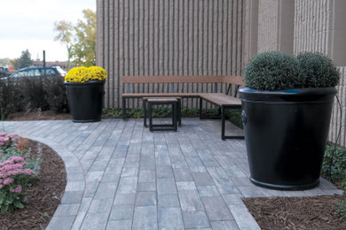 This is an example of a large industrial privacy and partial sun courtyard brick landscaping in Minneapolis.