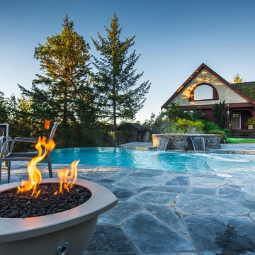Vanishing Edge Concrete pool with spa and water feature