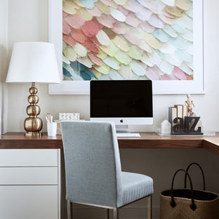 Design ideas for a transitional study room in Melbourne with beige walls, dark hardwood floors, a built-in desk and brown floor.