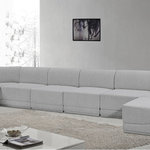 Meridian Furniture - Ollie Black Boucle Fabric U-Shaped Modular Sectional, Grey, 8-Piece: 6 Armless Chair, 2 Corner Chair - The Ollie Boucle Fabric Sectional is a truly stunning piece that boasts an elegant and attention-grabbing design. It is upholstered in a rich grey boucle fabric that feels soft and smooth to the touch, making it the perfect addition to any space that requires a touch of sophistication and style. The sectional's modular design ensures that it can easily fit into any room layout, while its plush cushioning provides optimum comfort for you and your guests. Whether you're entertaining guests or simply relaxing after a long day, the Ollie sectional is the perfect piece to help you unwind in style.