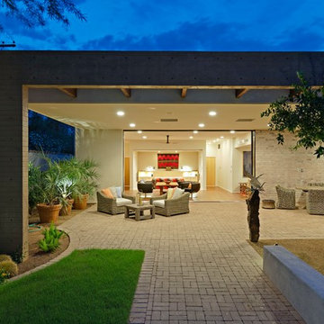 brick patio space and bedroom beyond
