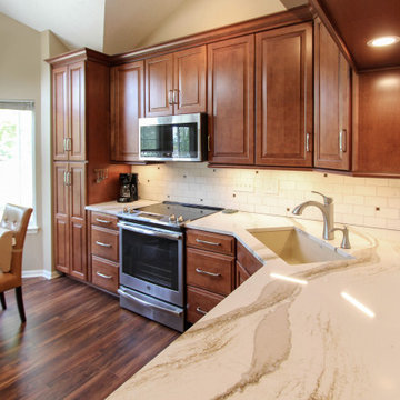 Waypoint Auburn Glaze Cabinets with Cambria Brittanicca Quartz Countertop