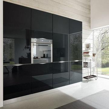 Modern white gloss kitchen with black island