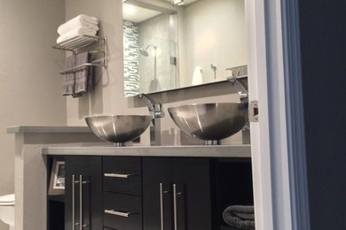 Example of a mid-sized minimalist 3/4 white tile and porcelain tile porcelain tile alcove shower design in San Diego with a vessel sink, black cabinets, quartz countertops, gray walls, flat-panel cabinets and a two-piece toilet