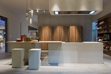 Photo of a modern eat-in kitchen in Miami with multiple islands.