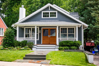 Craftsman blue two-story wood exterior home idea in Raleigh with a shingle roof