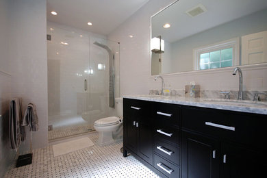 Example of a large transitional master white tile and subway tile marble floor and white floor alcove shower design in Chicago with recessed-panel cabinets, black cabinets, a two-piece toilet, white walls, an undermount sink, marble countertops, a hinged shower door and white countertops