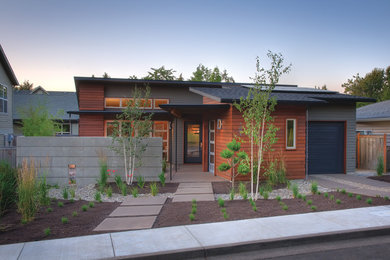 Inspiration for a small transitional gray one-story mixed siding house exterior remodel in Other with a shed roof and a shingle roof