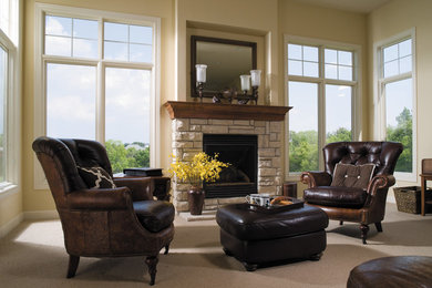 Mid-sized elegant formal and enclosed carpeted living room photo in Austin with beige walls, a standard fireplace, a stone fireplace and no tv