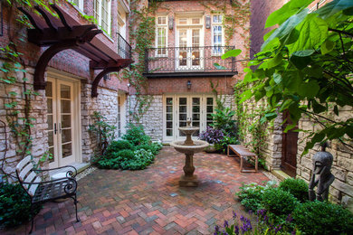 Photo of a small traditional courtyard partial sun formal garden for summer in Chicago.