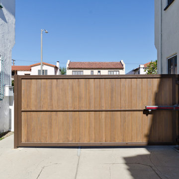Wood gates and matching garage door