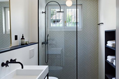 Bathroom - large contemporary master black and white tile and porcelain tile porcelain tile bathroom idea in Miami with open cabinets, black cabinets, a wall-mount toilet, white walls and a console sink