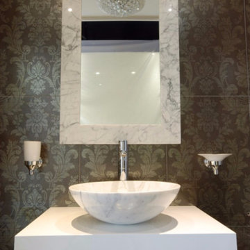 Polished Carrara countertop basin with matching Carrara-framed mirror