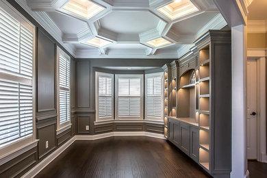 Example of a mid-sized transitional dark wood floor and brown floor study room design in Richmond with gray walls