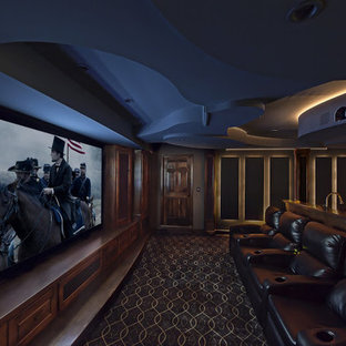 Home theater - traditional enclosed carpeted home theater idea in Birmingham with a projector screen