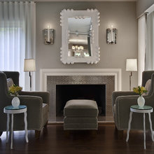 arm chairs by fireplace